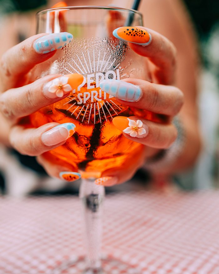 Floral nail art on a finished gel manicure