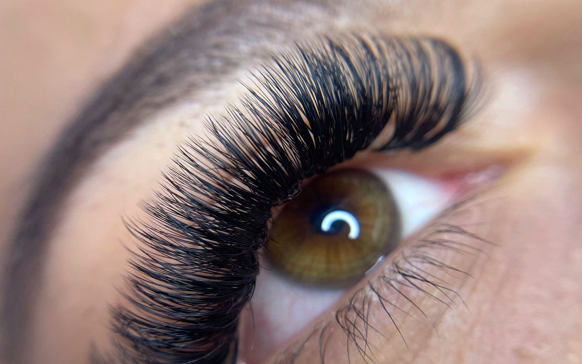 Close-up of an eye with a finished set of volume lash extensions