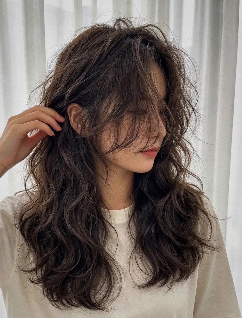 Shoulder-length hair with soft, loose digital perm waves