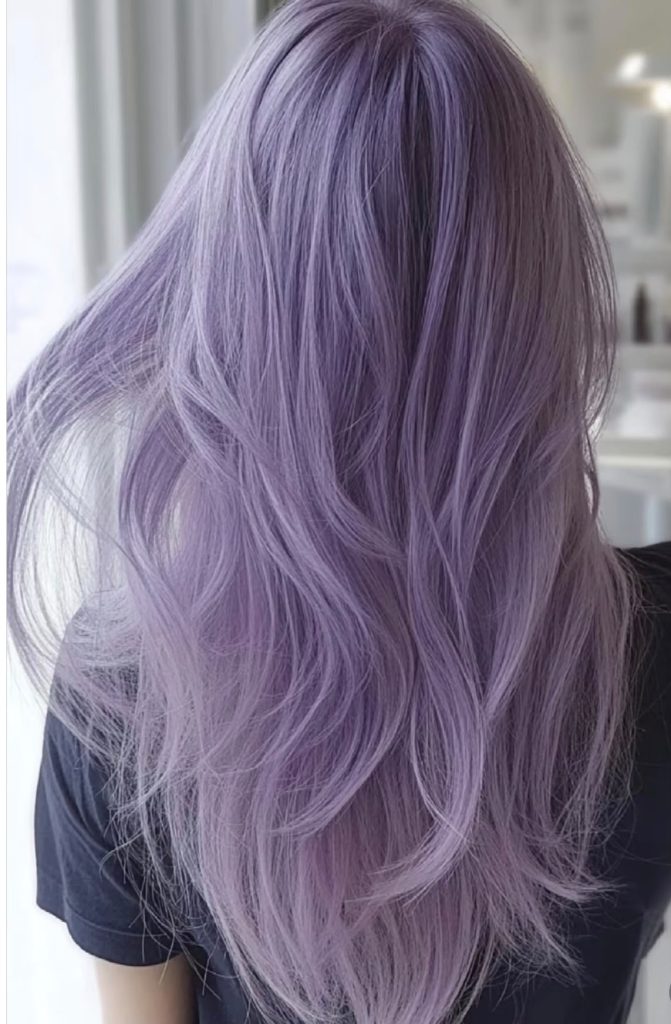 Long, softly waved hair coloured in pastel lavender